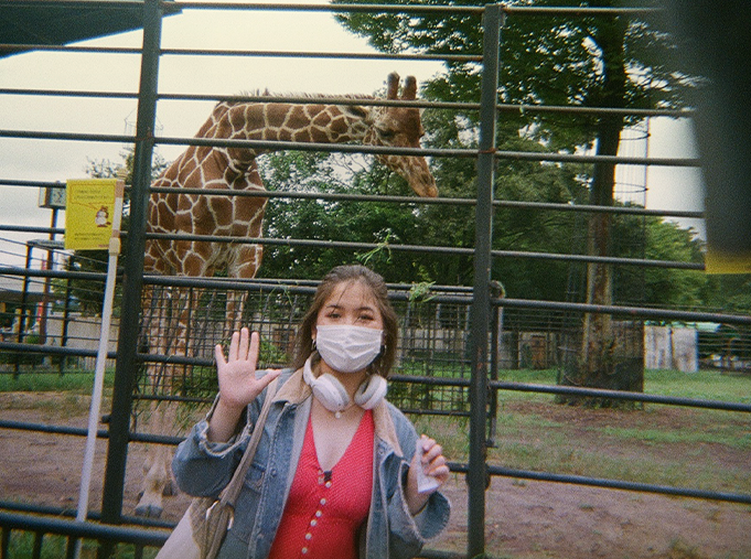 A vintage style picture of an exchange student at a zoo in Japan